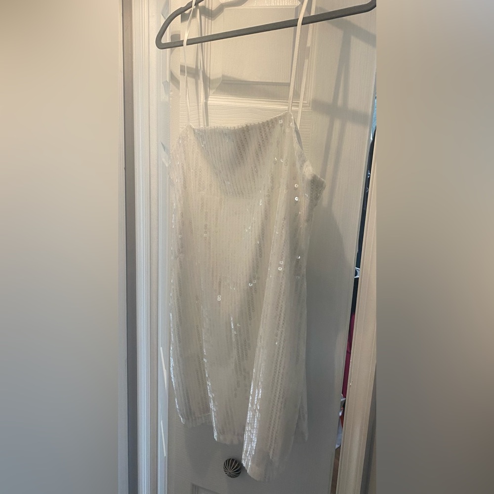 Brand new size Large. Tags still on it. Never worn. Emmy white sequin mini dress